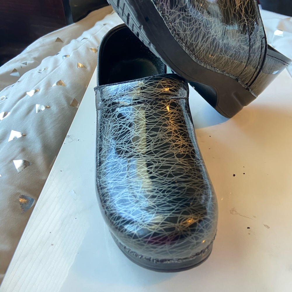 Dansko Black with silver scribble clogs